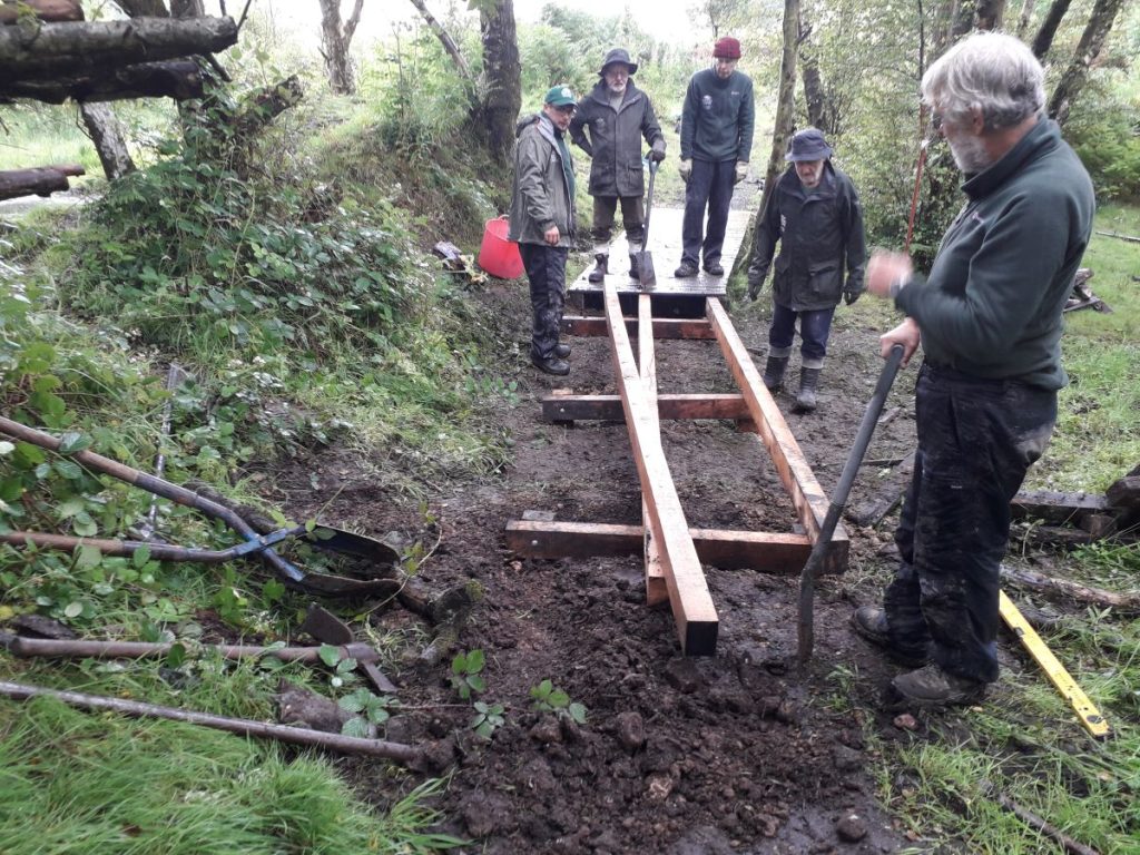 volunteers building a boardwalk