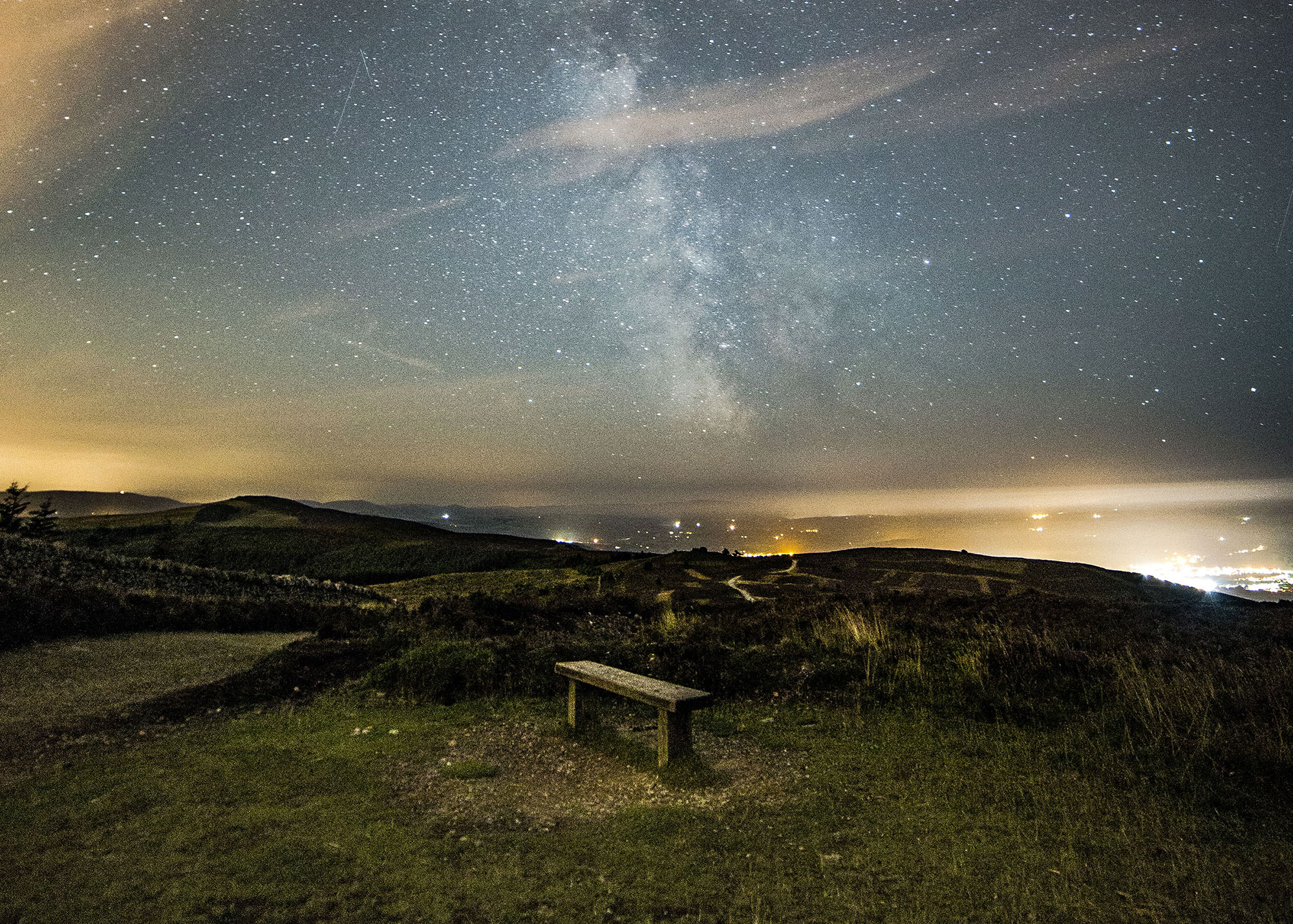 dark skies with bench